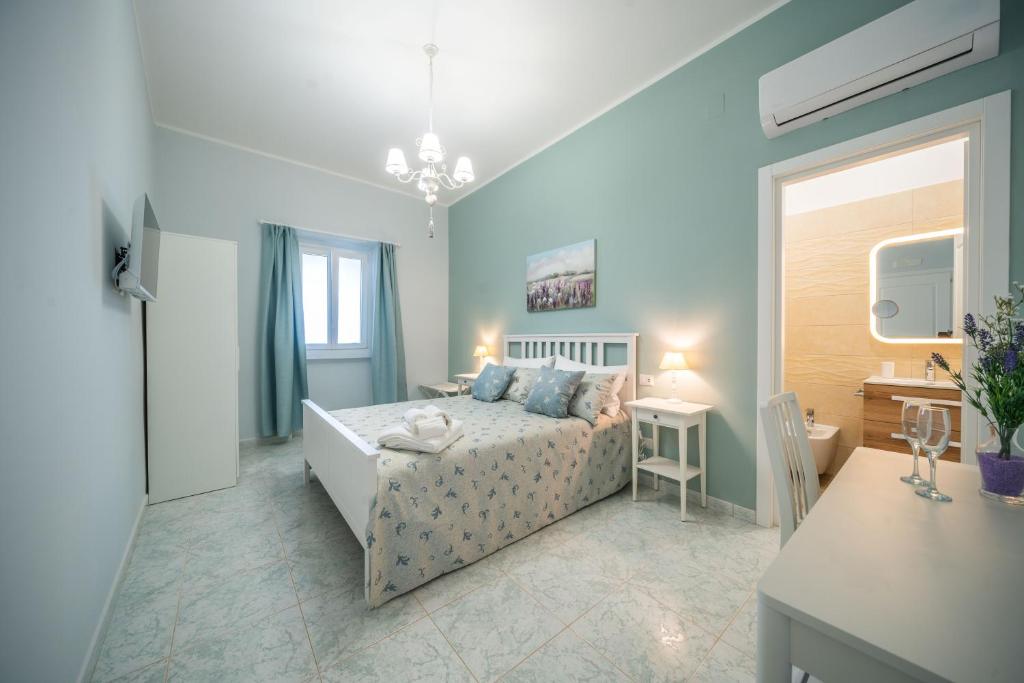 Postel nebo postele na pokoji v ubytování Masseria Agata