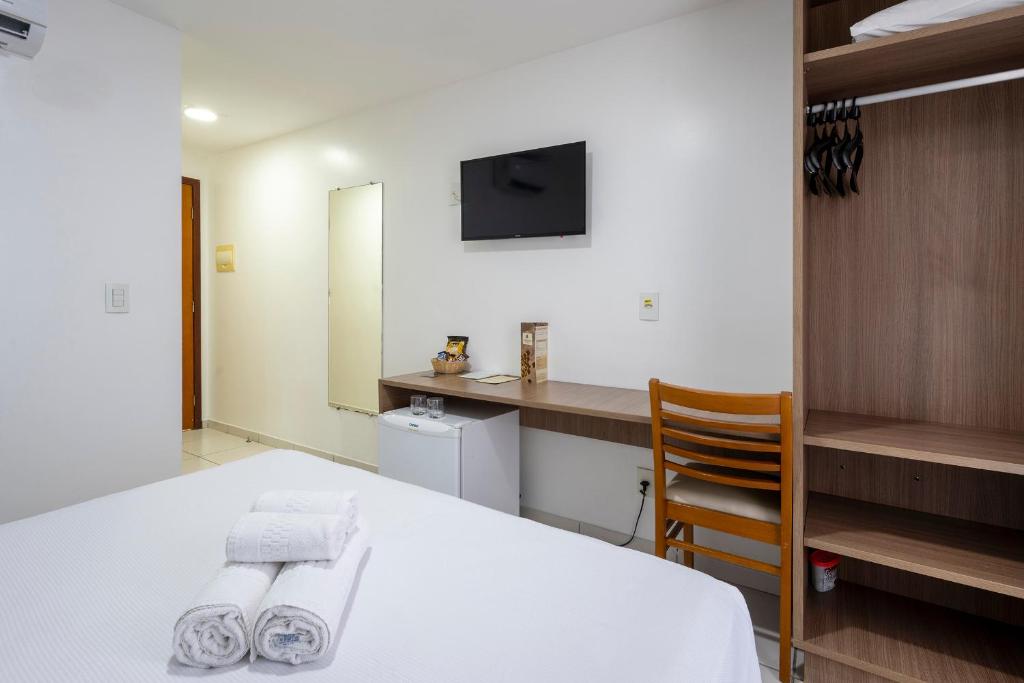 Cama ou camas em um quarto em Villa Park Hotel