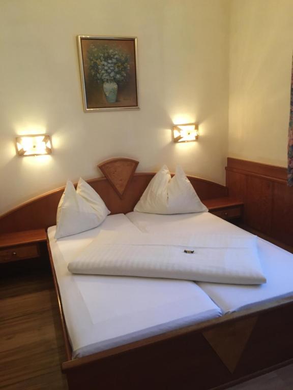 Postel nebo postele na pokoji v ubytování Cityhotel Ratheiser