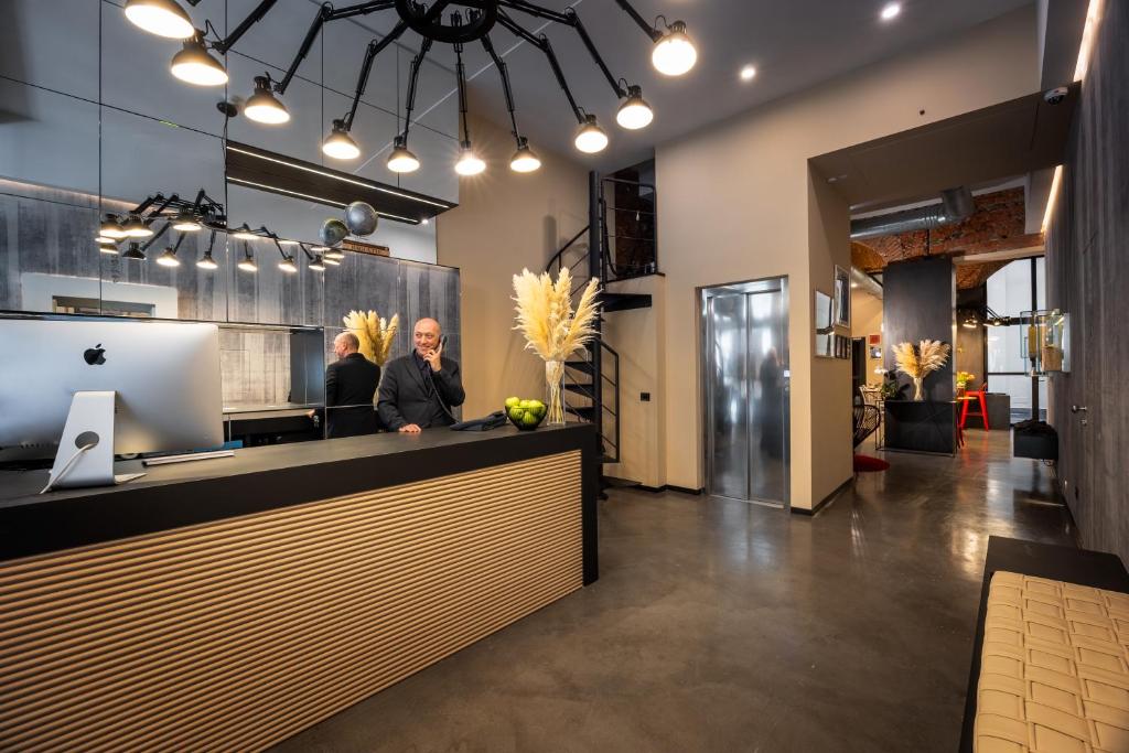 A kitchen or kitchenette at Globus Urban Hotel