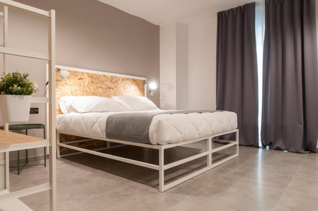 Posteľ alebo postele v izbe v ubytovaní Residence Hotel Moderno