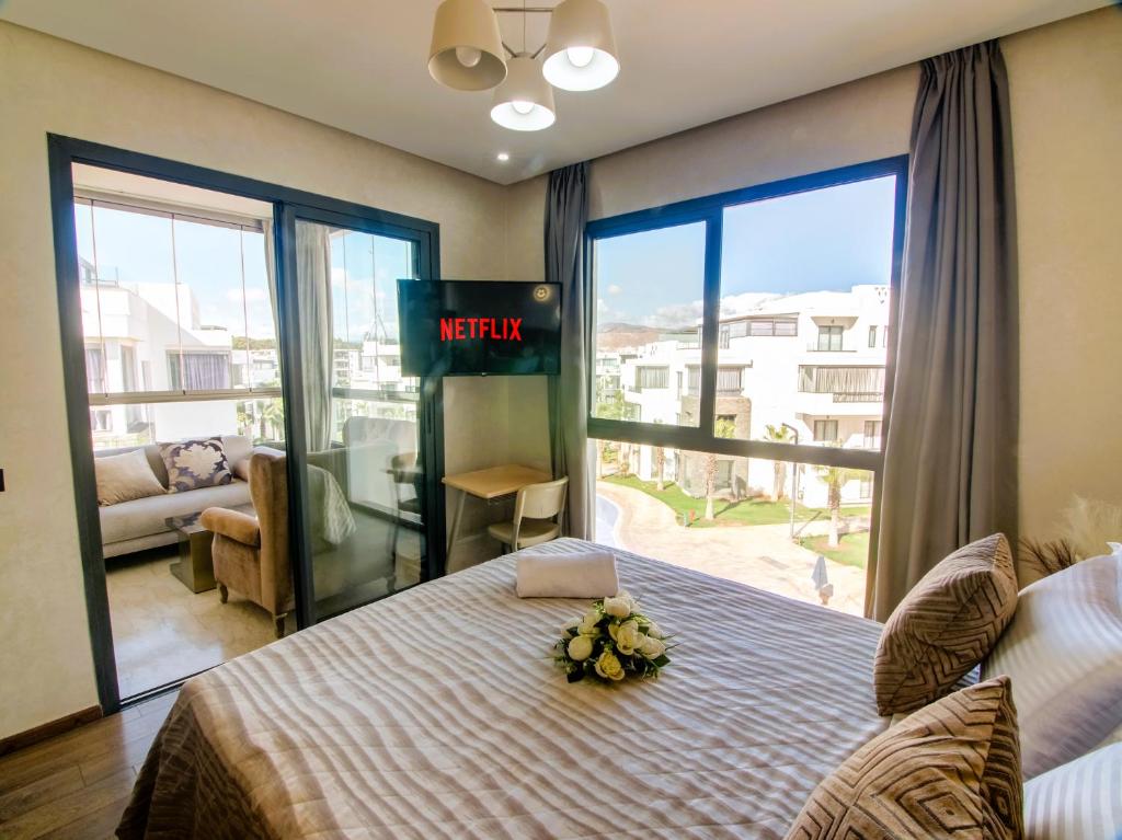 Ένα ή περισσότερα κρεβάτια σε δωμάτιο στο Luxury Apartment Vacation Agadir 10