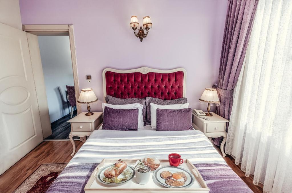 Postel nebo postele na pokoji v ubytování Olive Garden Apart