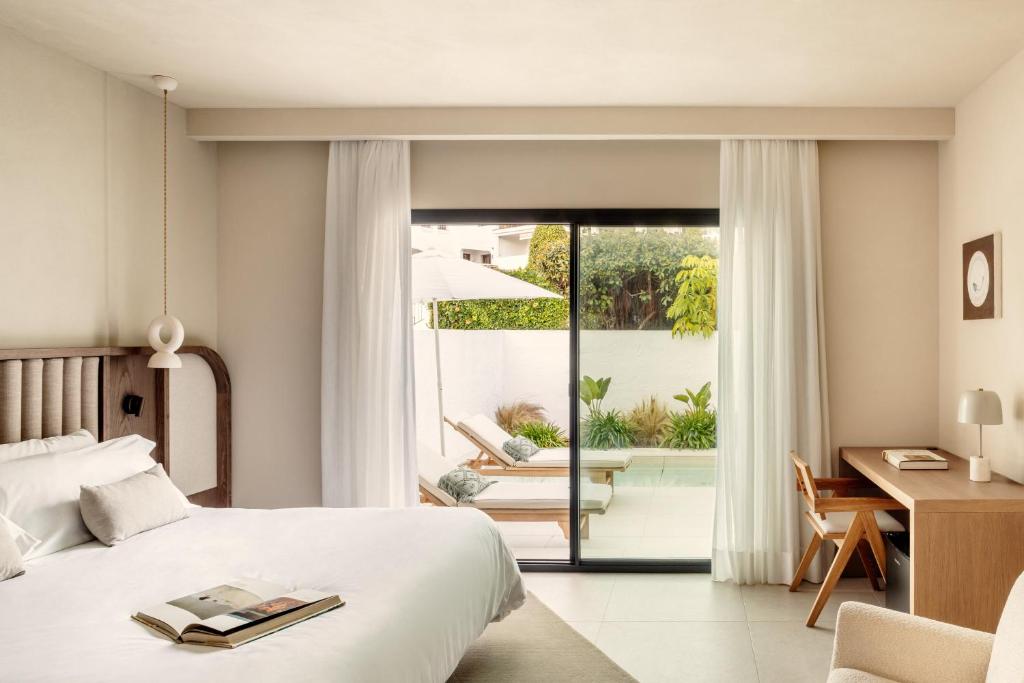 Posteľ alebo postele v izbe v ubytovaní Anfitrión Villas & Suites
