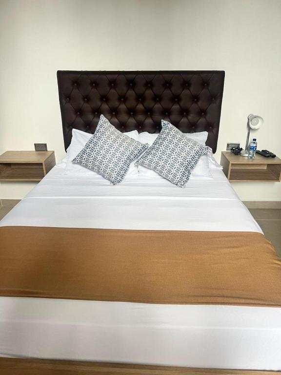 Postel nebo postele na pokoji v ubytování Star AV 37 HOTEL
