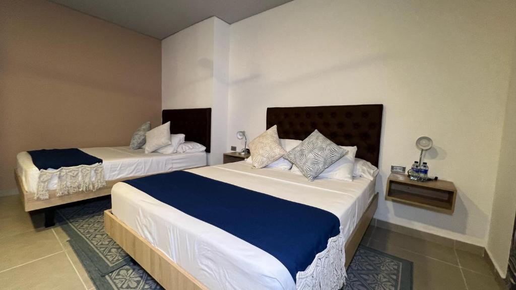 Postel nebo postele na pokoji v ubytování Star AV 37 HOTEL