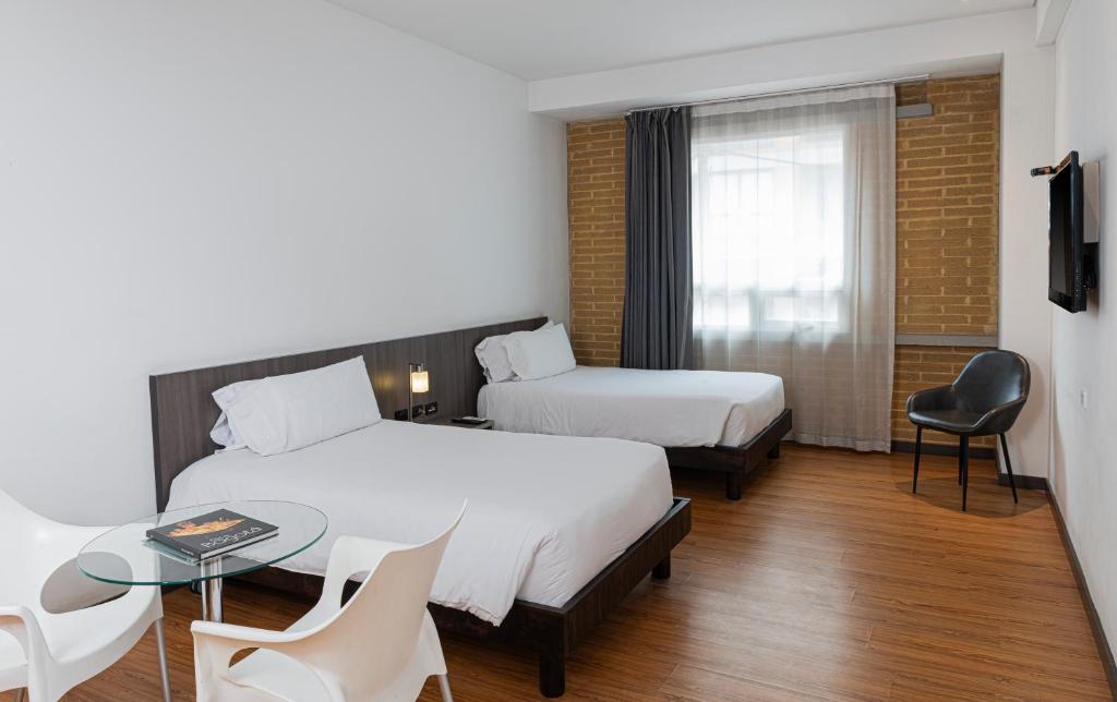 Postel nebo postele na pokoji v ubytování Hotel Viaggio 617