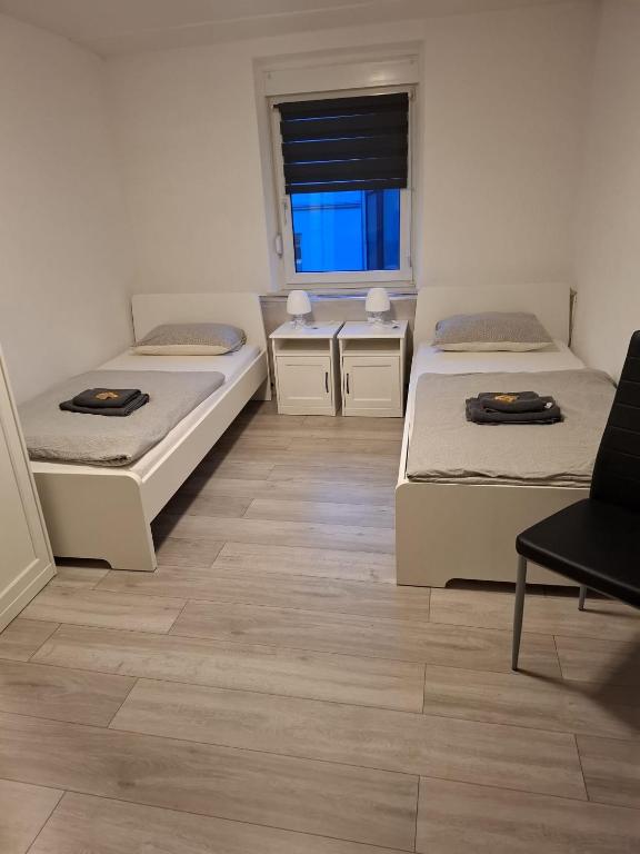 Postel nebo postele na pokoji v ubytování Hotel Garni Krone