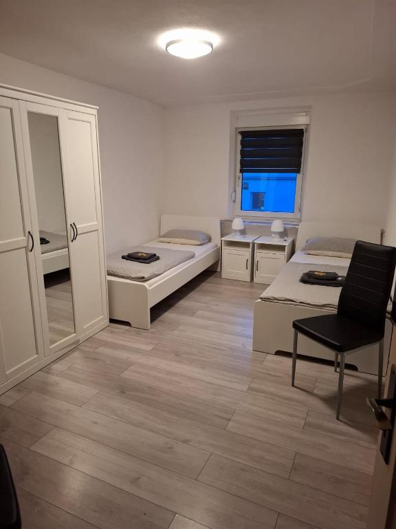 Postel nebo postele na pokoji v ubytování Hotel Garni Krone