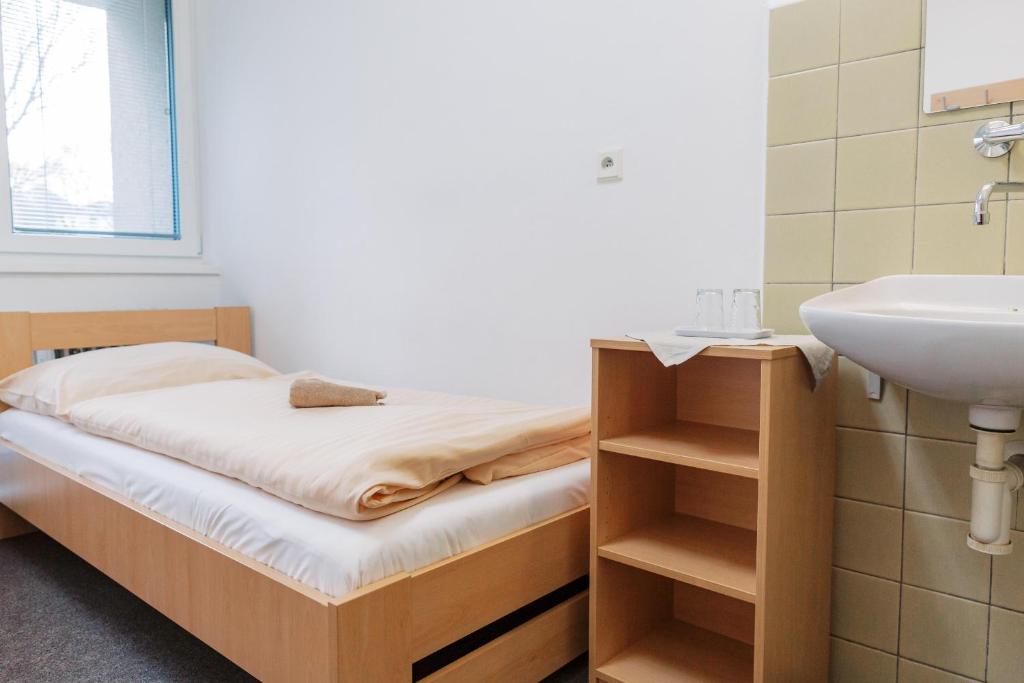 Postel nebo postele na pokoji v ubytování Turistická ubytovňa Zuberec pod Grápou