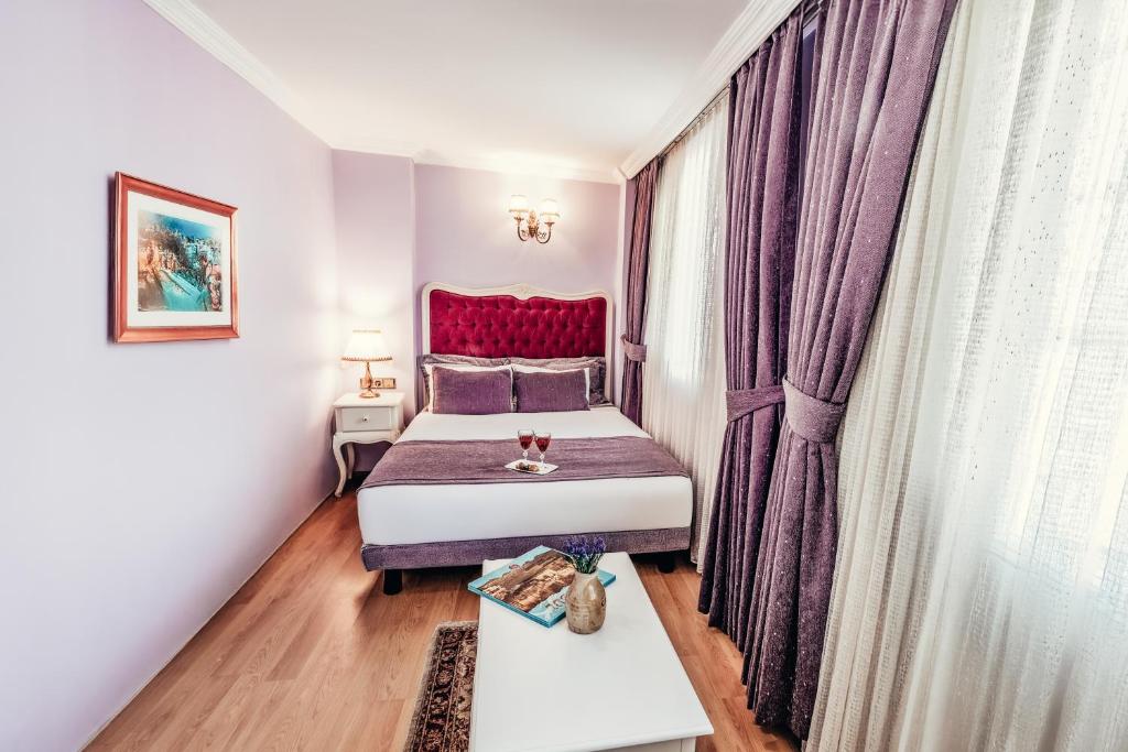 Postel nebo postele na pokoji v ubytování Olive Garden Apart