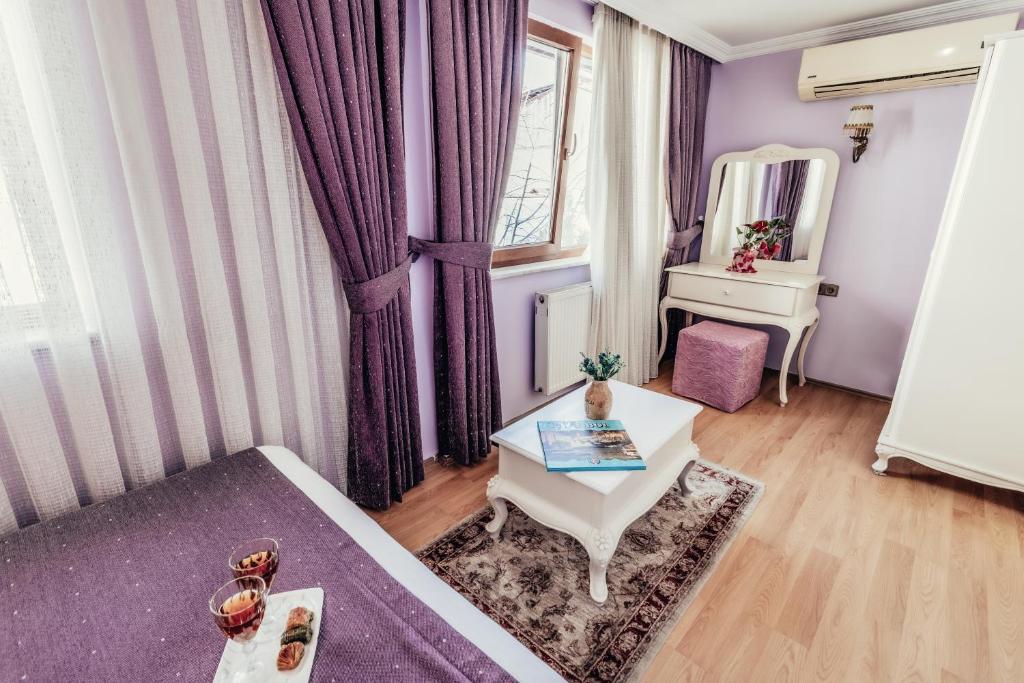 Postel nebo postele na pokoji v ubytování Olive Garden Apart