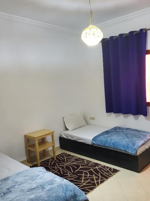 Postel nebo postele na pokoji v ubytování WARZAZAT Hostel