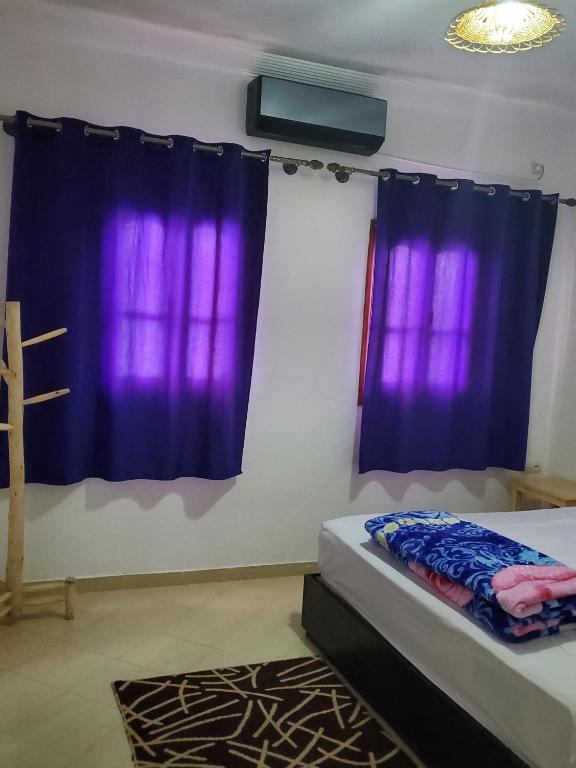 Postel nebo postele na pokoji v ubytování WARZAZAT Hostel