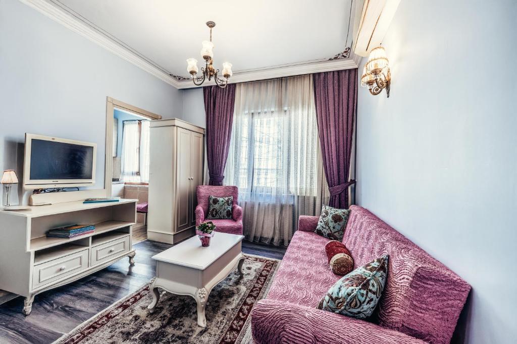 TV a/nebo společenská místnost v ubytování Olive Garden Apart