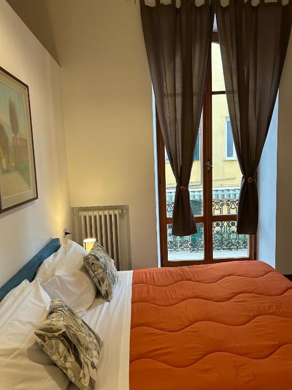Postel nebo postele na pokoji v ubytování Cavour 142 Rooms