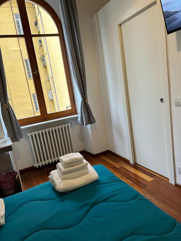 Postel nebo postele na pokoji v ubytování Cavour 142 Rooms