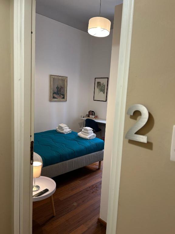 Postel nebo postele na pokoji v ubytování Cavour 142 Rooms