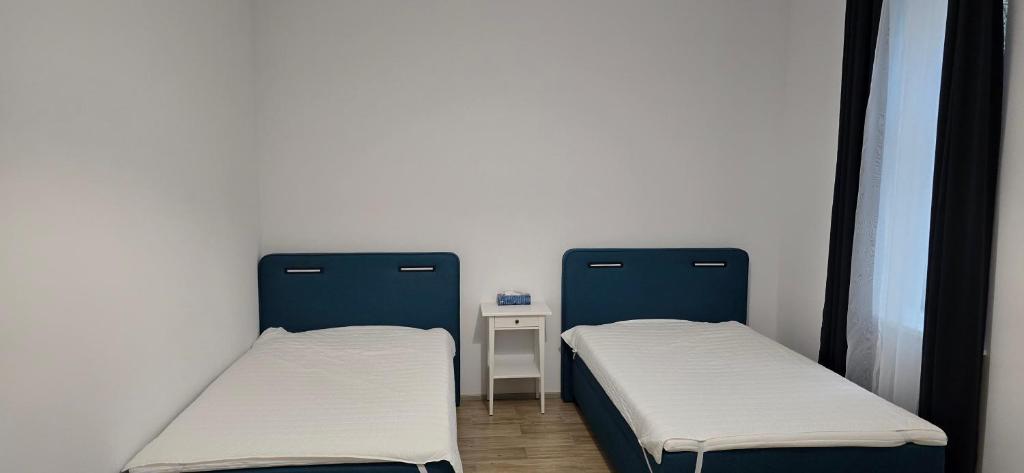 Postel nebo postele na pokoji v ubytování Znojmo apartmány