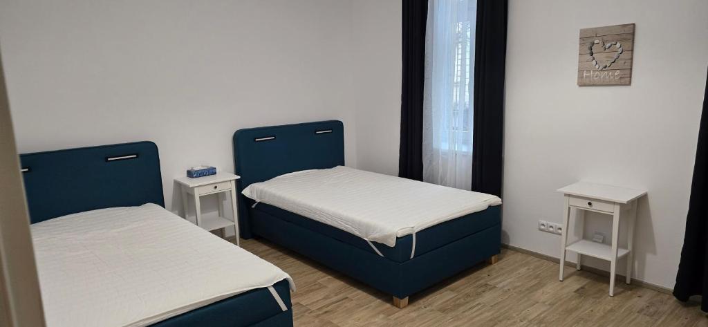 Postel nebo postele na pokoji v ubytování Znojmo apartmány