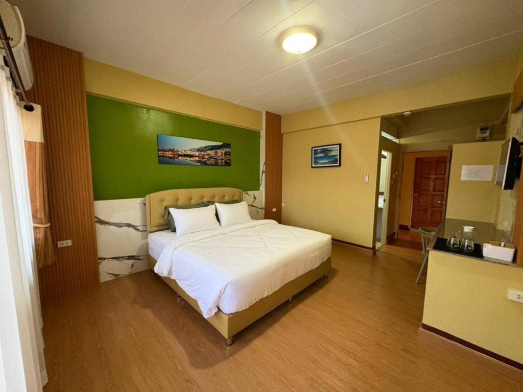 Postel nebo postele na pokoji v ubytování BanPunmanus Hotel