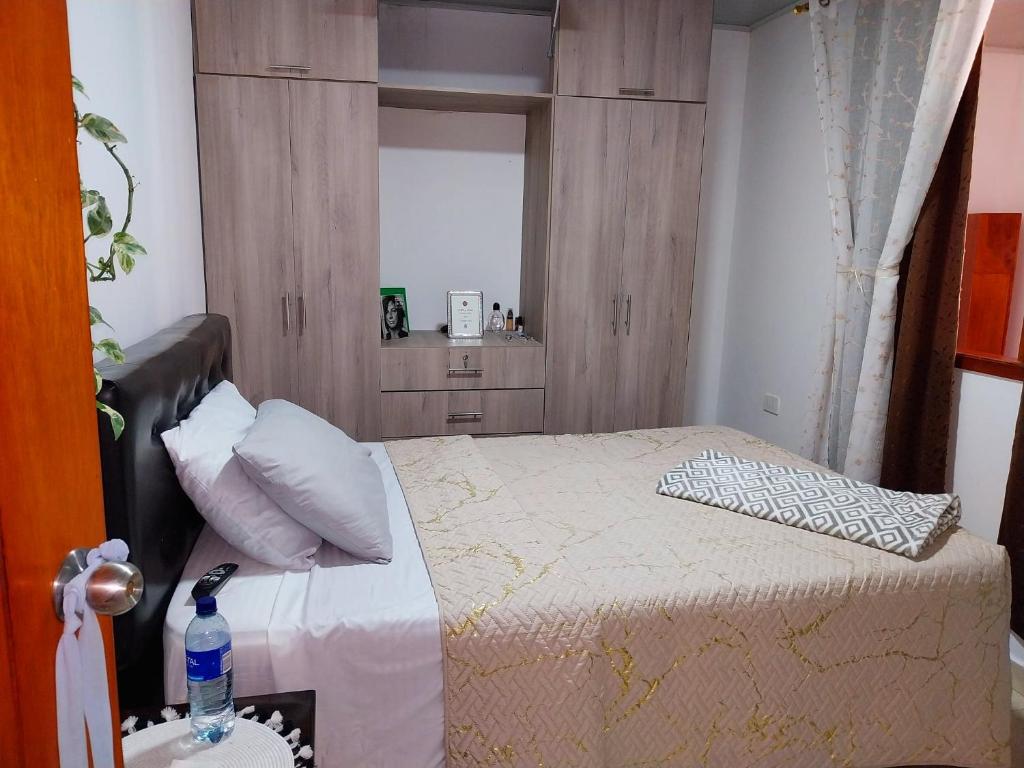 Postel nebo postele na pokoji v ubytování La Casa de Doña Gilma en Pijao