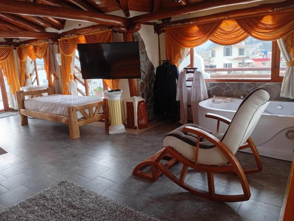 TV a/nebo společenská místnost v ubytování Hotel Maderanegra By Huasicama