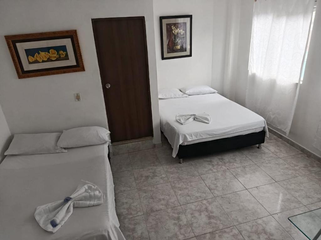 Postel nebo postele na pokoji v ubytování Hotel Bayadera Real