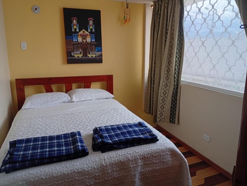 Postel nebo postele na pokoji v ubytování Hotel Maderanegra By Huasicama
