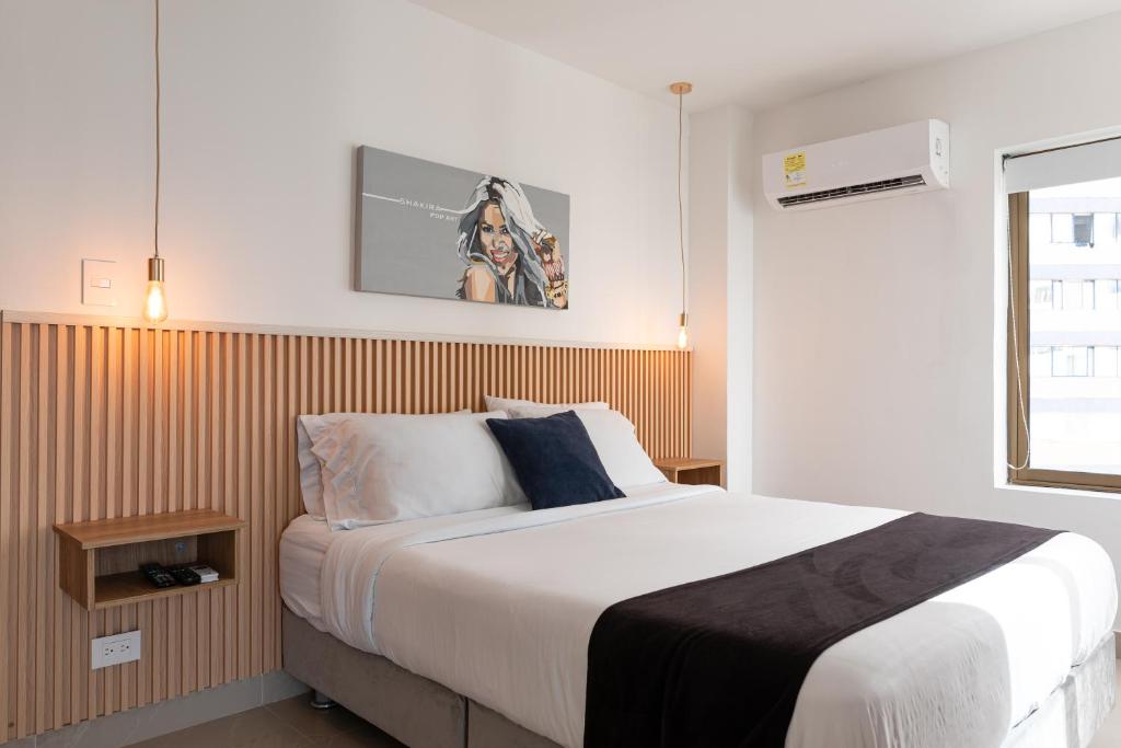 Кровать или кровати в номере Apartamento en Bocagrande - Piscina, Jacuzzi y Mar