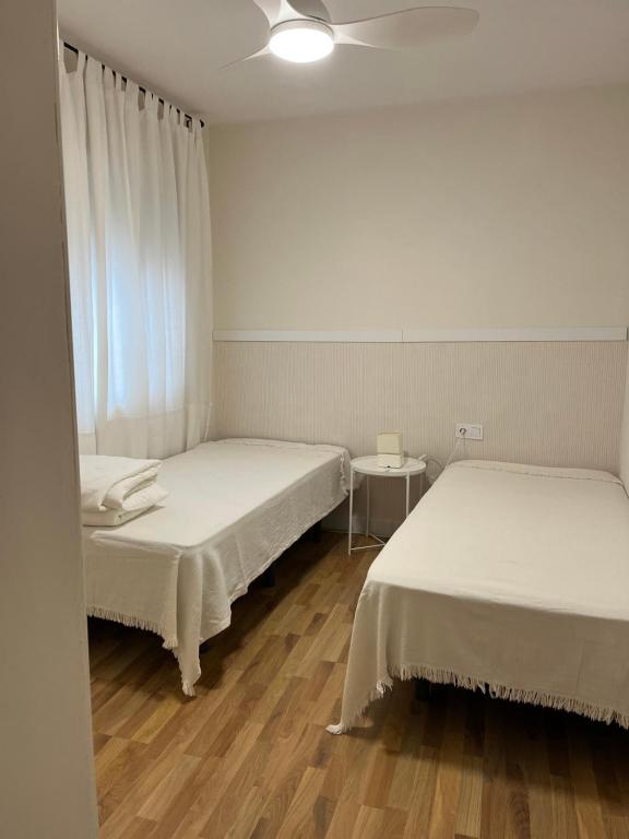 A bed or beds in a room at TESORO