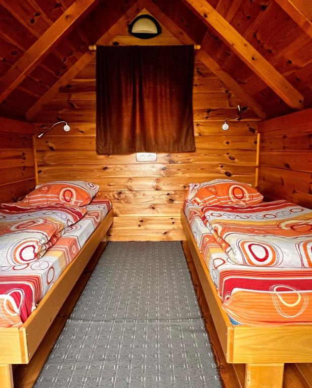 Postel nebo postele na pokoji v ubytování Small Bungalow - Tara Place