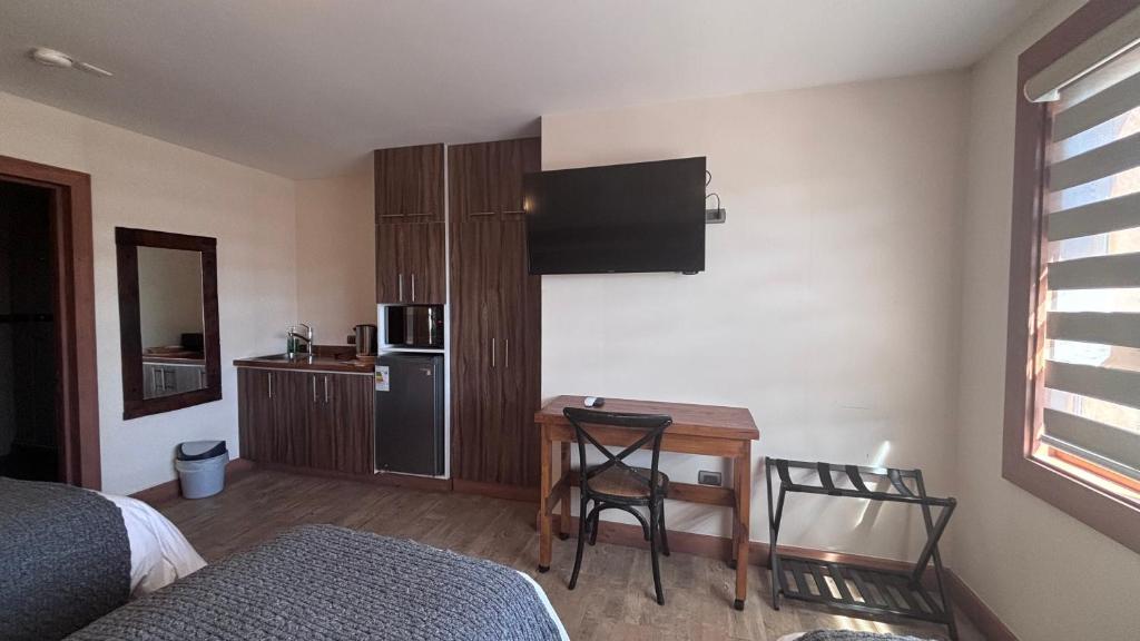 Kuchyň nebo kuchyňský kout v ubytování Entre Cumbres Apart Hotel