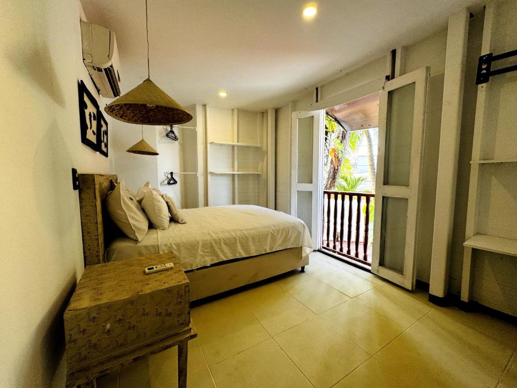Ένα ή περισσότερα κρεβάτια σε δωμάτιο στο Auaecoco Hotel