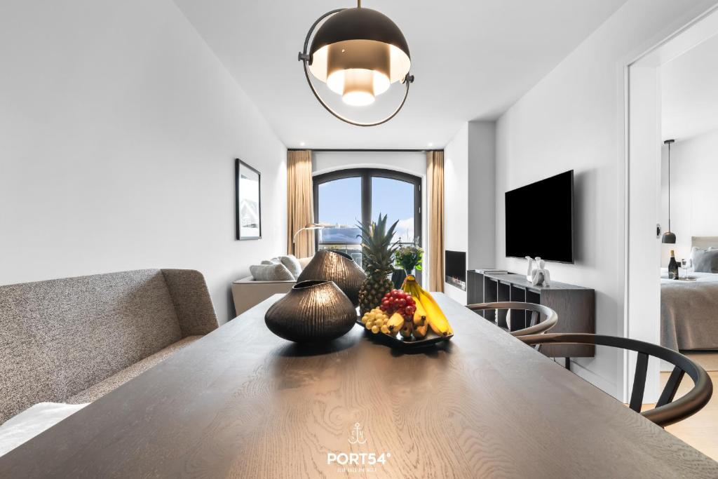 TV a/nebo společenská místnost v ubytování Turtle Bay Suite List auf Sylt