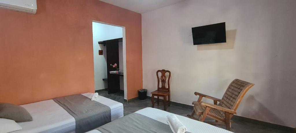 TV in/ali zabaviščno središče v nastanitvi Hotel Rosa de los vientos