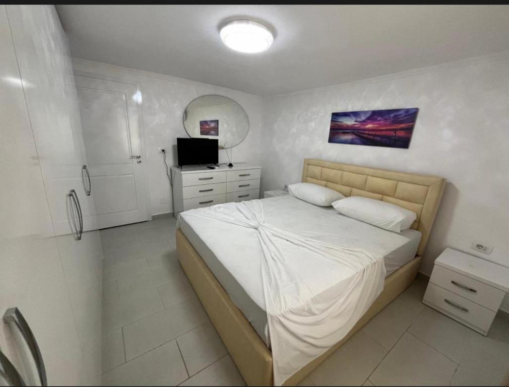 Ένα ή περισσότερα κρεβάτια σε δωμάτιο στο Vila flavjo