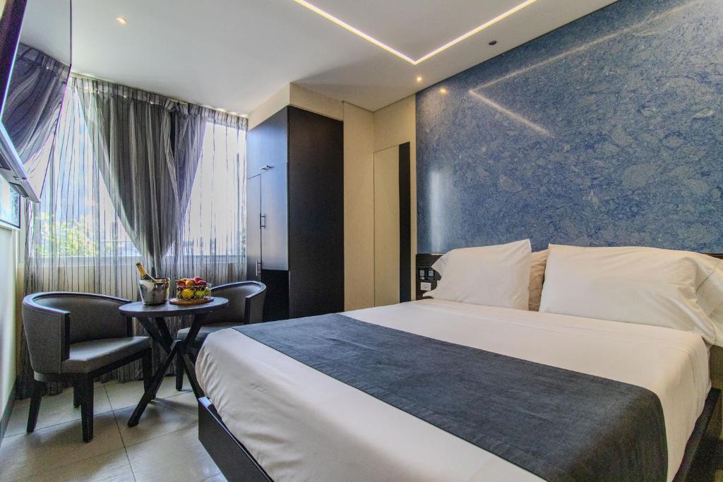 Postel nebo postele na pokoji v ubytování Haven A Design Hotel