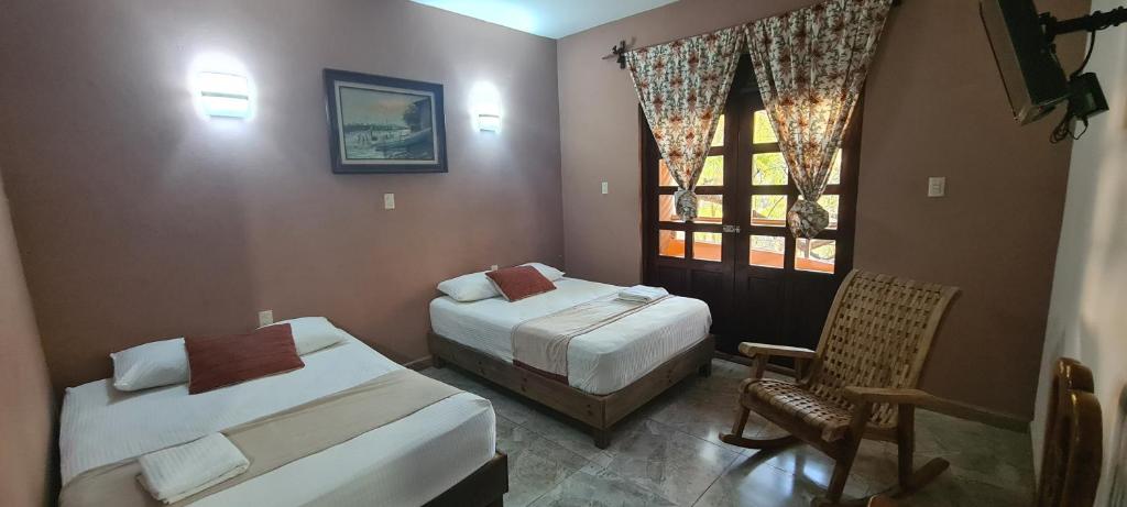 Postelja oz. postelje v sobi nastanitve Hotel Rosa de los vientos