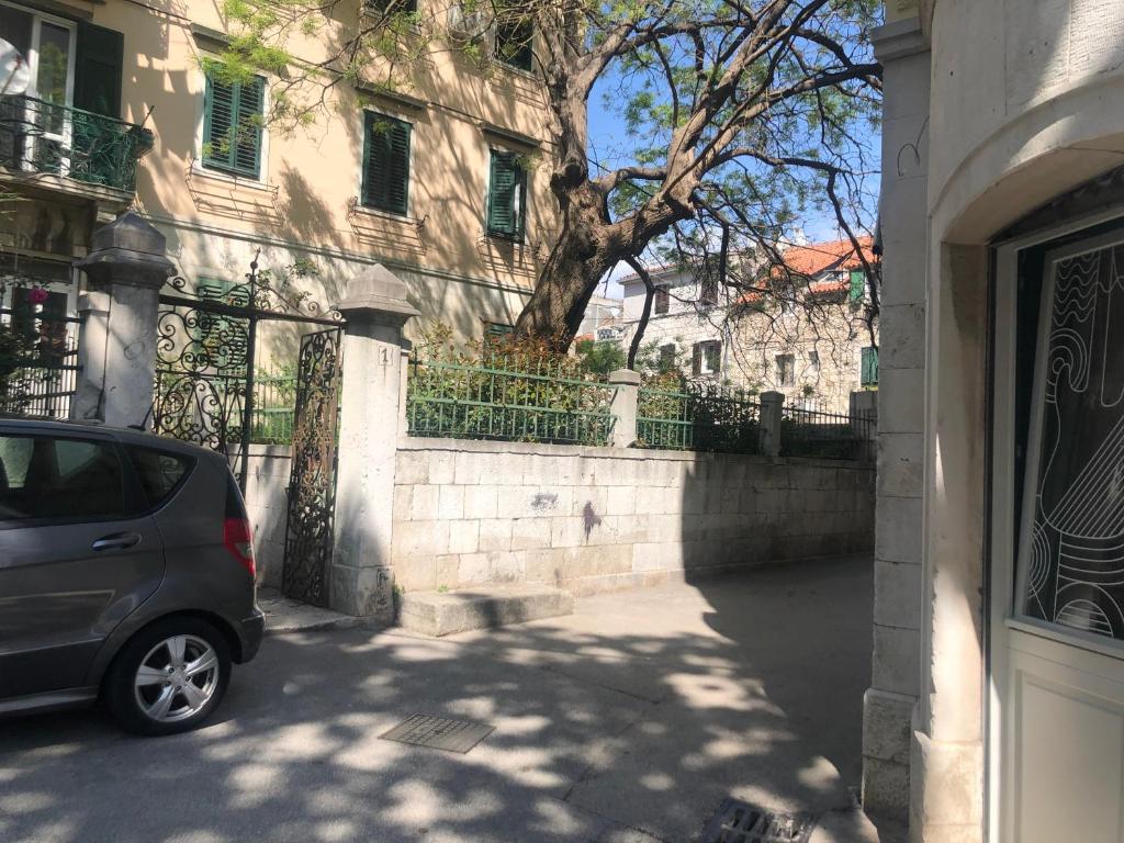 a car parked in front of a building at Old Town House Manosa Split in Split