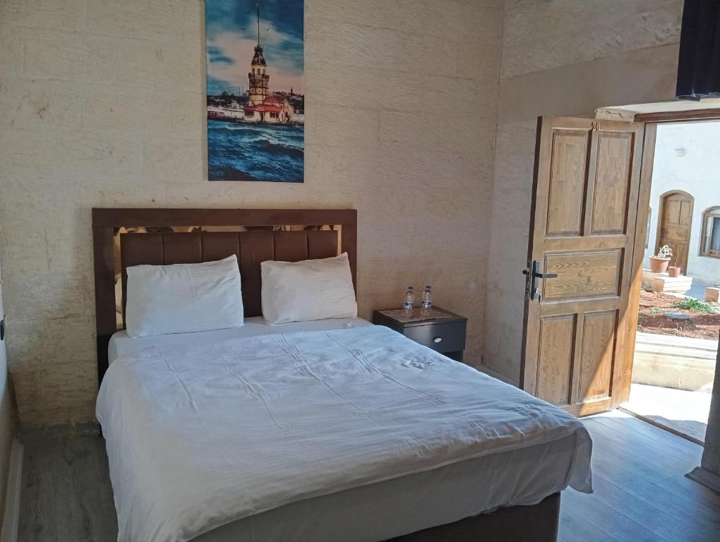 Postel nebo postele na pokoji v ubytování Aslan Guest House
