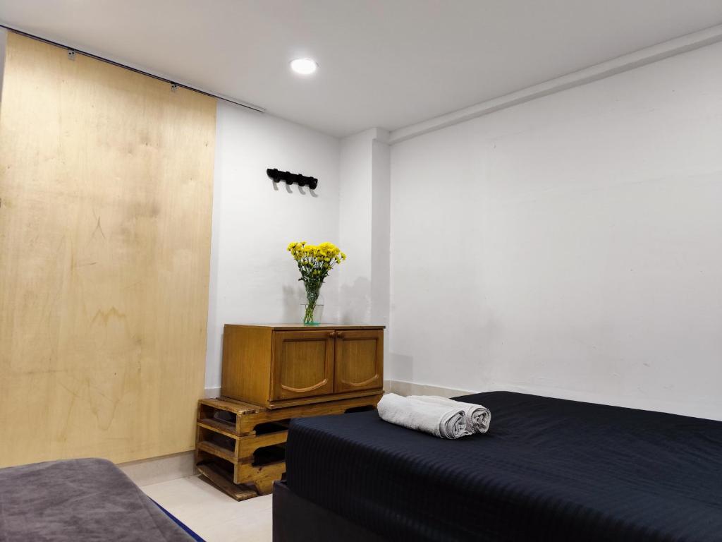 Postel nebo postele na pokoji v ubytování Mico Loco Casa Hostal