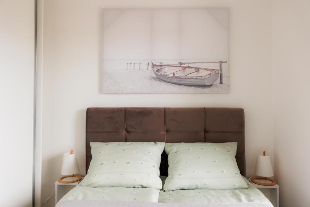 Postel nebo postele na pokoji v ubytování Duma Apartment