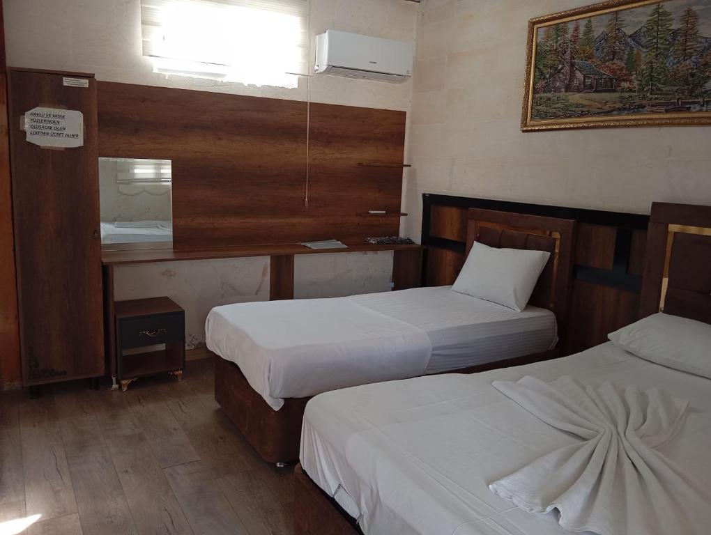 Postel nebo postele na pokoji v ubytování Aslan Guest House
