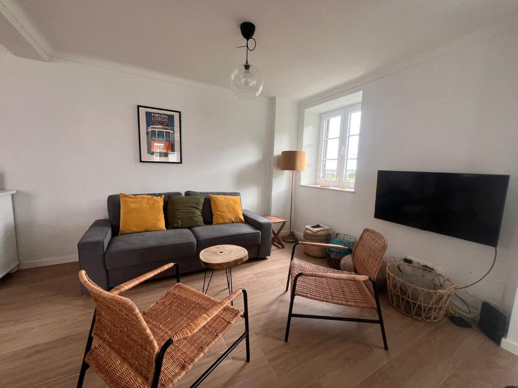 TV a/nebo společenská místnost v ubytování Cozy surfhouse at Obidos Lagoon