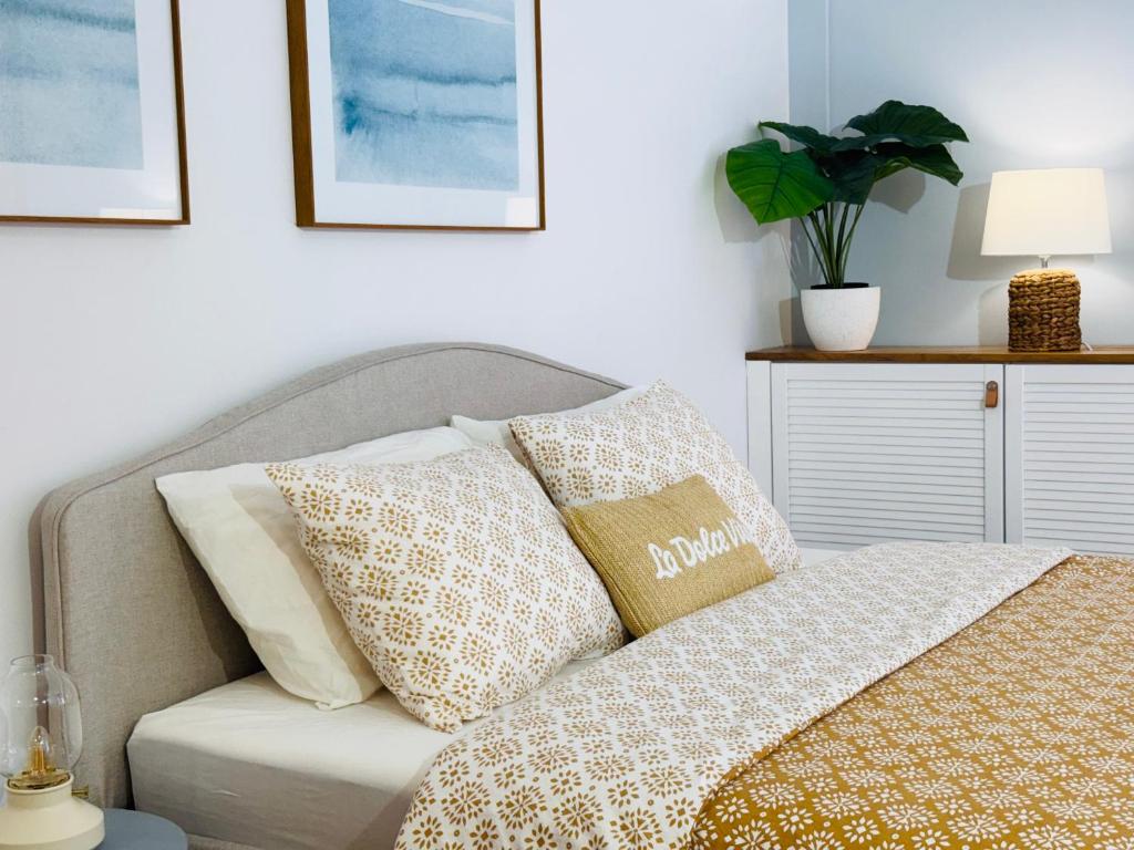 a couch with pillows on it in a living room at SEAESTA Cosy Sea Apartment in Koper