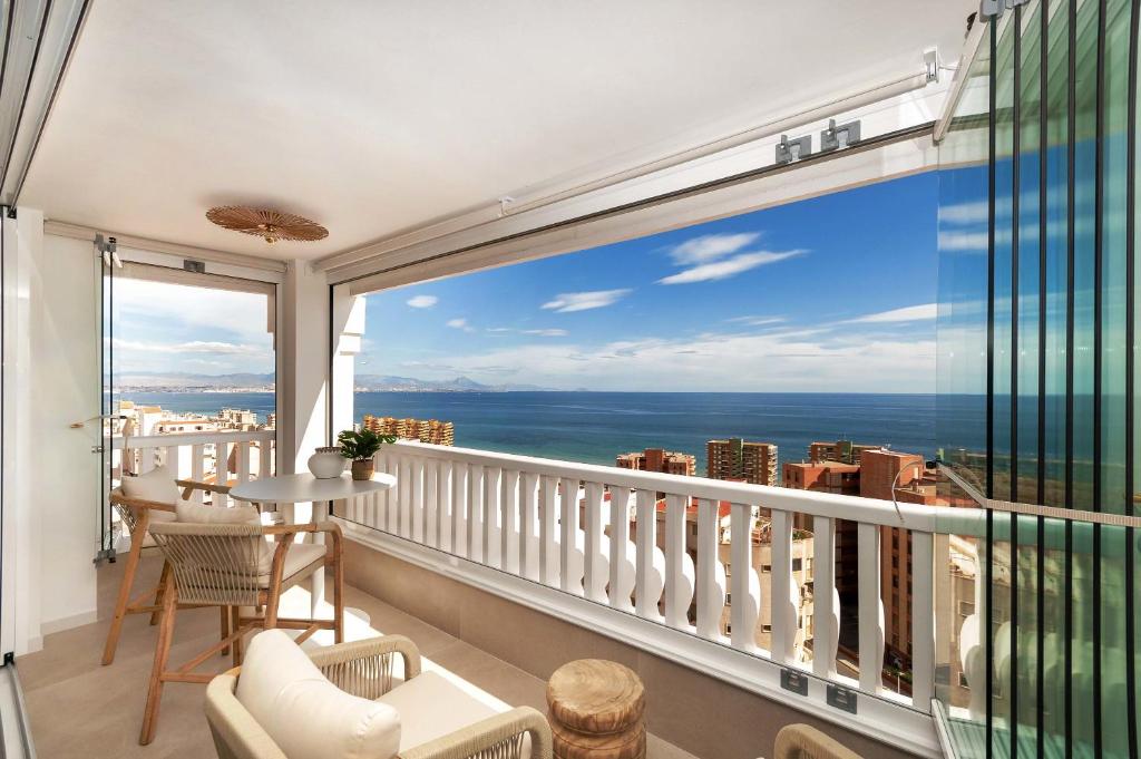 a balcony with a view of the ocean at eme de Maison - luxury only two in Arenales del Sol