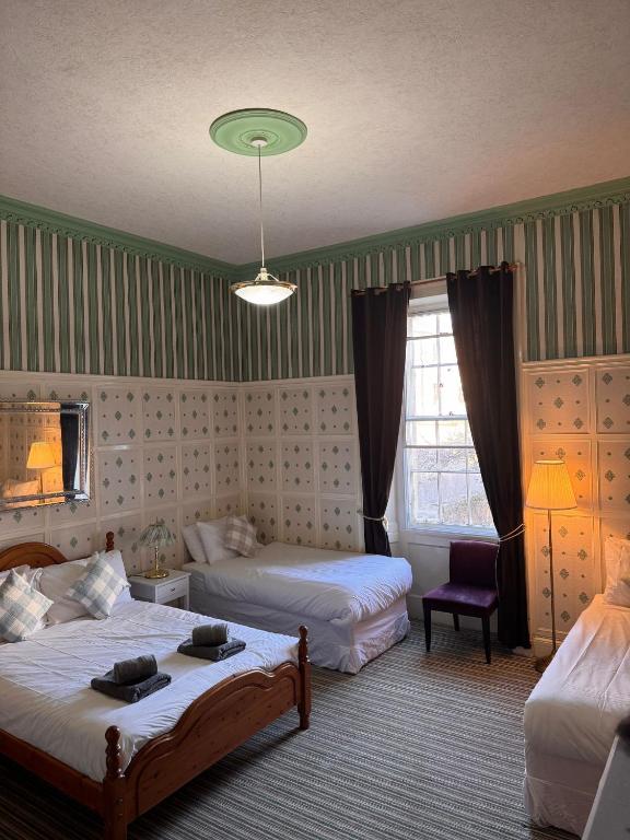 Postel nebo postele na pokoji v ubytování Edinburgh Travel Guest House
