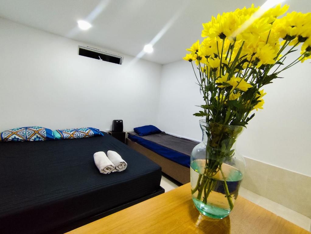 Postel nebo postele na pokoji v ubytování Mico Loco Casa Hostal