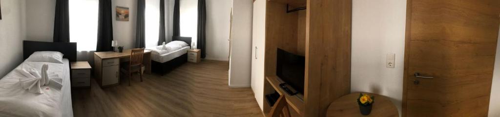 Postel nebo postele na pokoji v ubytování Hotel am Wasserturm